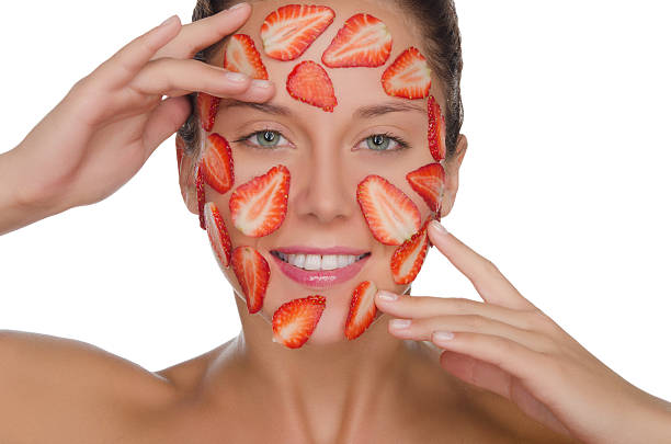 glückliche frau mit maske mit erdbeeren - strawberry fruit single object food stock-fotos und bilder