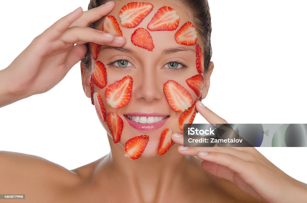 happy woman with mask of strawberries happy woman with mask of strawberries isolated on white Strawberry Stock Photo