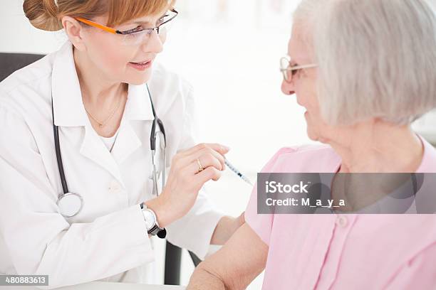 Receives An Injection Of Insulin Stock Photo - Download Image Now - Adult, Assistance, Assistant