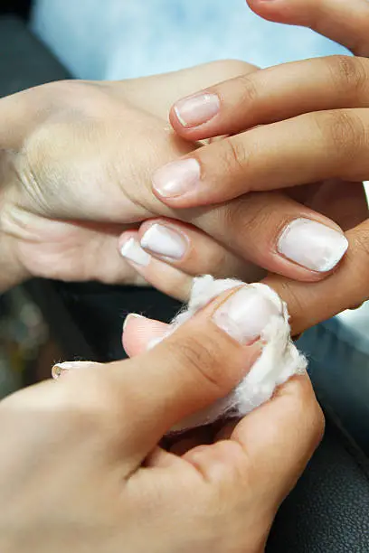 French manicure and removing nailpolish bride's hand for wedding preparation