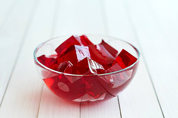 istock Red jelly cubes in glass bowl 480886286