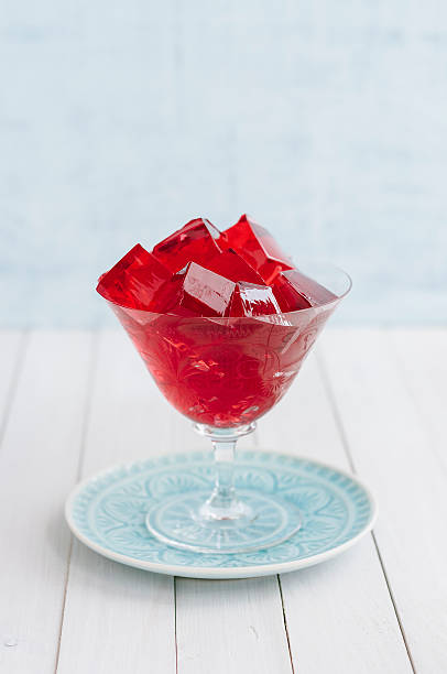 istock Red jelly cubes in glass 480886290