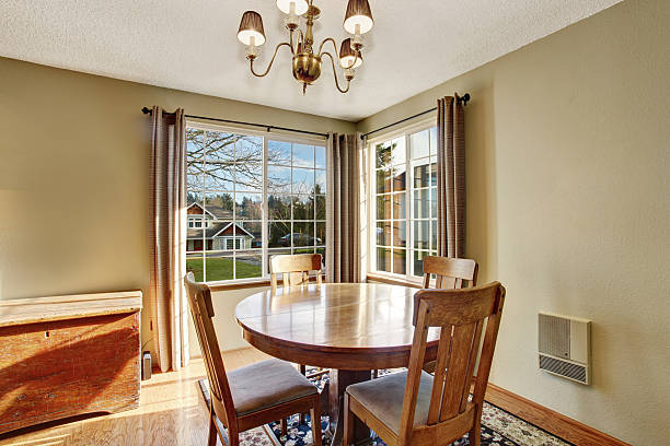 istock classic dinning room with table chairs, and hardwood floor. 480894442