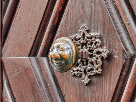 Apfelweibla, Vintage doorknob on antique door, background