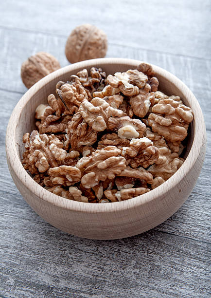 istock Walnuts in wooden bowl 480897309