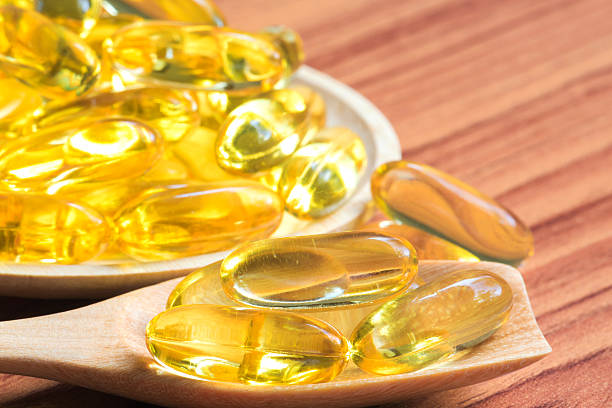 istock Cloes-up fish oil capsules 480897526