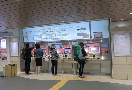 Osaka Japan - April 24, 2015: People buy subway tickets at Osaka station in Osaka Japan.