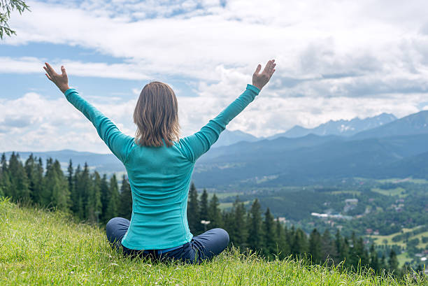 istock Woman Meditate at the Mountains 480902518