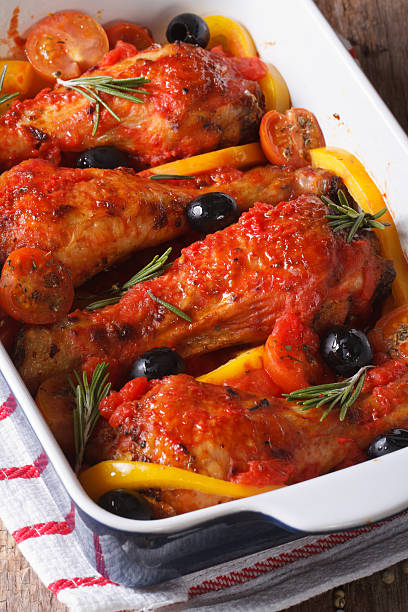 istock Chicken legs baked in tomato with olives and pepper. vertical 480903960