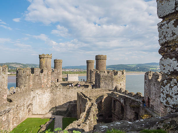 View on Conwy Castle, Wales Сonwy, Wales - September 28, 2013: View on the battlements of massive Conwy Castle in Wales built by king Edward I as one of the fortifications during the conquest of Wales in the 13th Century conwy castle stock pictures, royalty-free photos & images