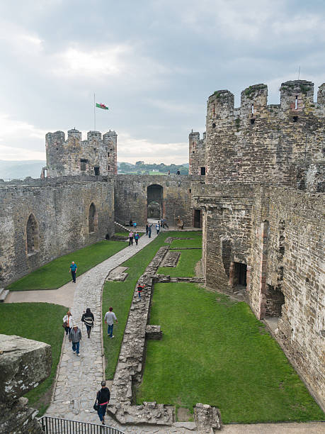 View on Conwy Castle, Wales Сonwy, Wales - September 28, 2013: View on the battlements of massive Conwy Castle in Wales built by king Edward I as one of the fortifications during the conquest of Wales in the 13th Century conwy castle stock pictures, royalty-free photos & images