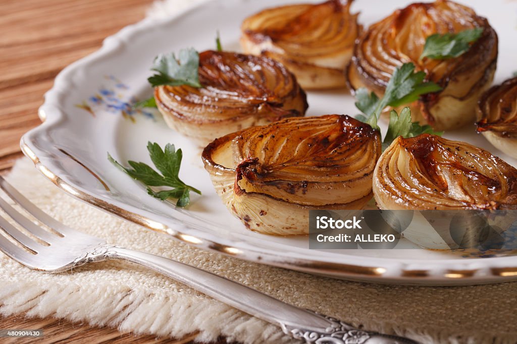 caramelized onions on a plate close-up. horizontal caramelized onions on a white plate close-up. horizontal Onion Stock Photo