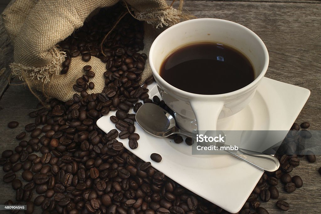 Coffee on grunge wooden Coffee on grunge wooden background Arabia Stock Photo