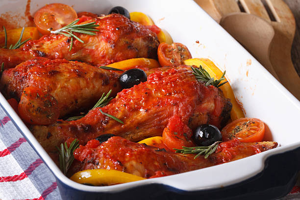 istock Chicken legs baked in tomato with olives closeup. Horizontal 480907134