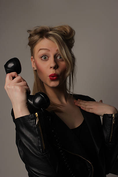istock young cute blond girl with an old handset 480908014