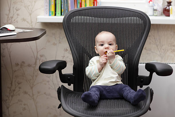 istock Baby on office chair 480908694
