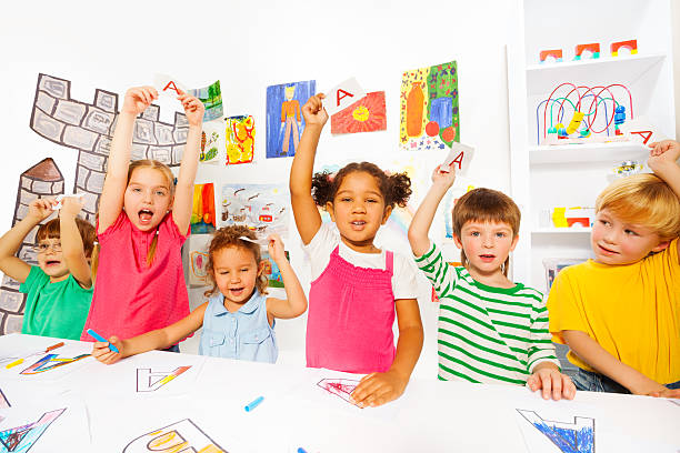 istock Group of kids learn first letters in reading class 480909534