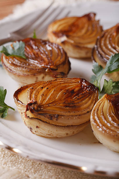 istock caramelized onions and parsley close-up. Vertical 480909554