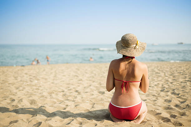 istock Woman on the summer beach 480910765