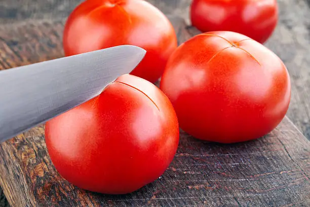 Photo of tomatoes are prepared for blanching