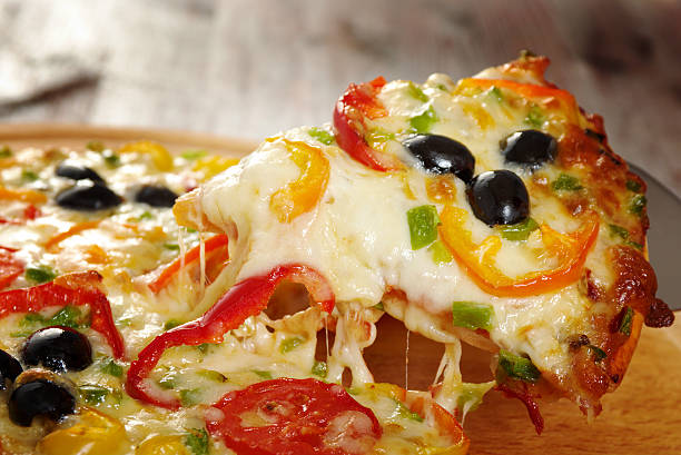 istock taking slice of pizza,melted cheese dripping 480914334
