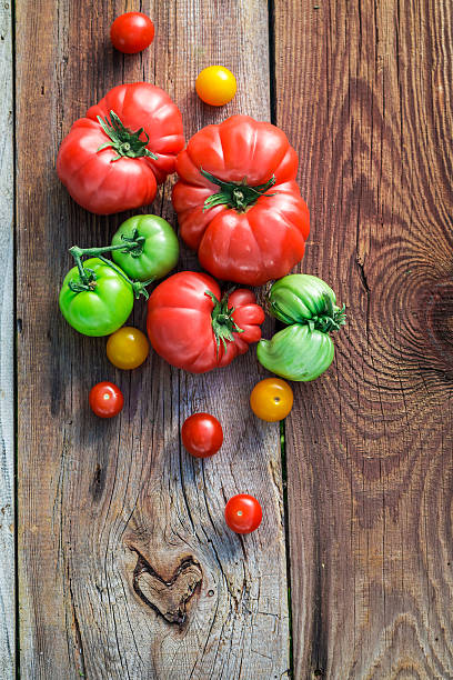 istock Healthy tomatoes on old wooden table 480914928