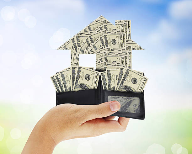 istock Businessman holding house 480915188