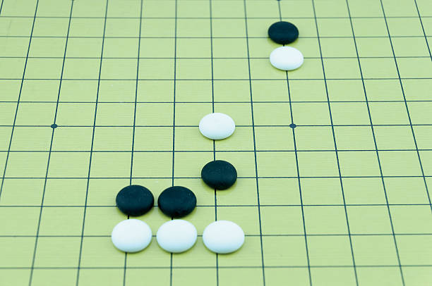 istock Go game board with black and white stones 480915324
