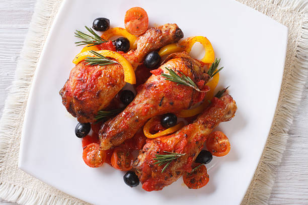 istock Chicken legs in tomato sauce on plate, horizontal top view 480916992