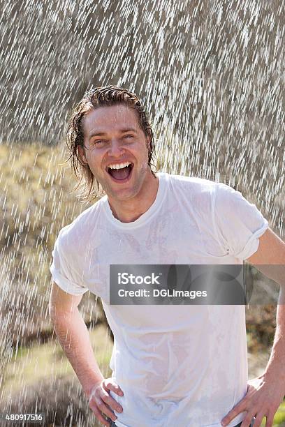 Male Having Fun In The Rain Stock Photo - Download Image Now - Wet, T-Shirt, Men