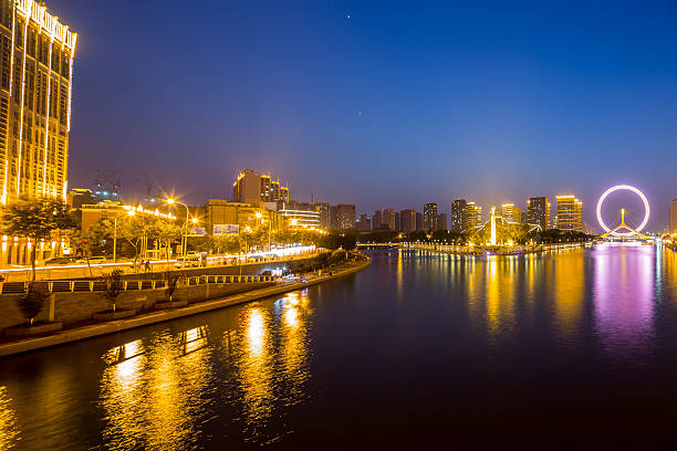istock Illuminated skyline and cityscape at riverbank 480919636