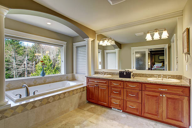 istock Elegant master bathroom with window above bathtub. 480920172