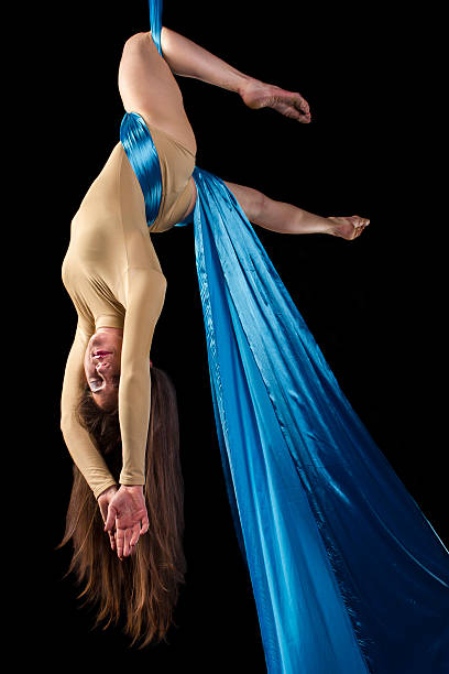 istock Young gymnast doing exercise on aerial silks 480920706