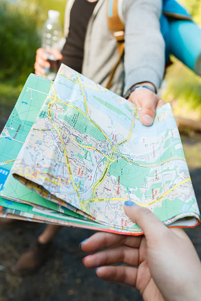 istock travelers looking for a way across the map, hiking 480923324