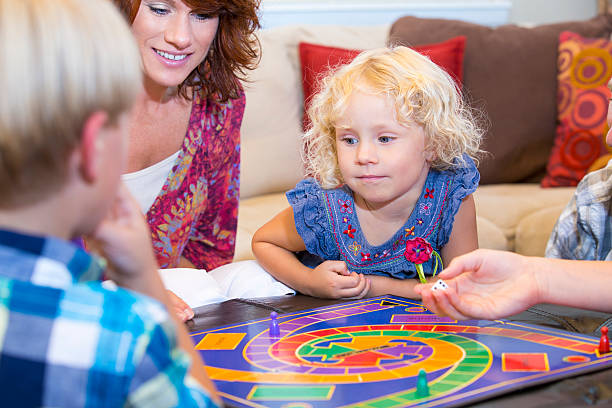 istock Family playing an exciting board game at home 480926641