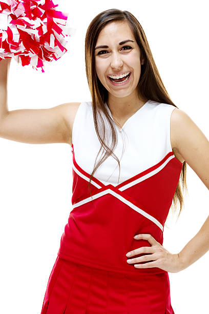istock Happy cheerleader standing with pom-pom 480926647