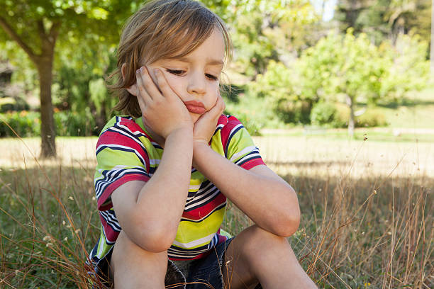 istock Sad little boy in the park 480926710