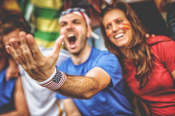 istock american and spanish supporter at the soccer stadium 480926837