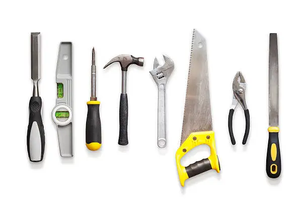 A selection of hand tools, shot overhead on a white background, lit by studio lights, featuring a clipping path. 
