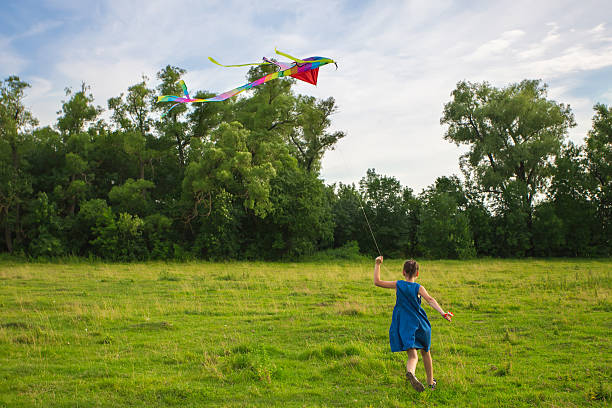 istock irl running with colorful kite 480927412