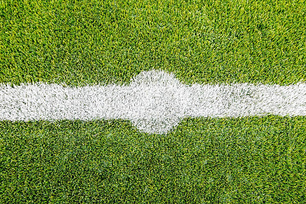 Chalk line on artifical turf soccer or football field Centre spot chalk line on artificial turf soccer or football field , The green artificial grass is brand new artifical grass stock pictures, royalty-free photos & images