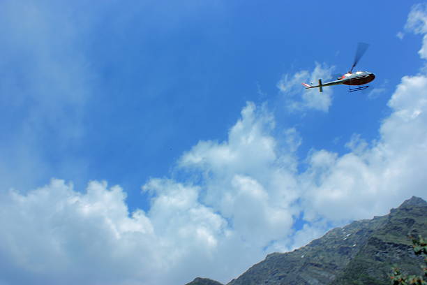 A helicopter (chopper) carrying people to Hindu pilgrimage Kedarnath dham in Himalayan region of Uttarakhand state in India.