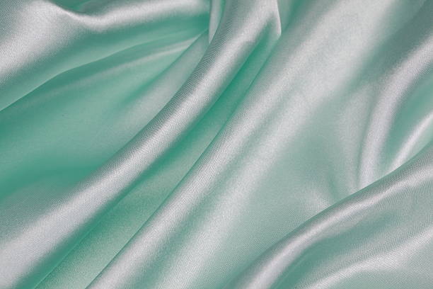 istock Light green Silk cloth of wavy abstract background 480940784