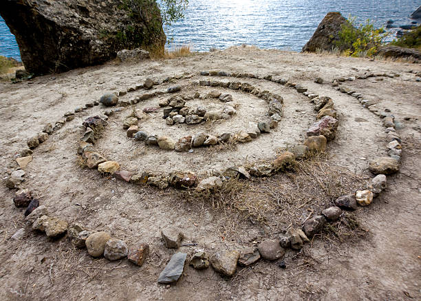 istock Stones laid in spiral on the sea shore 480940805