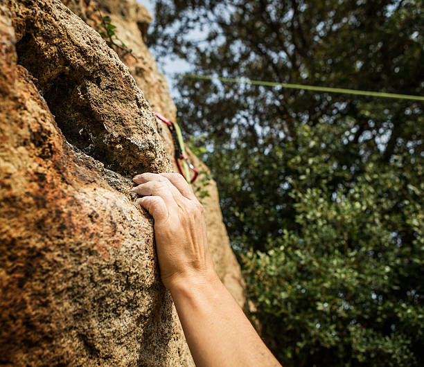 istock Female rock climber freeclimbing 480945323