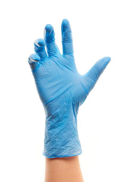 feminino médico de mão em uma luva azul esterilizados para cirurgia - close to moving up closed women imagens e fotografias de stock