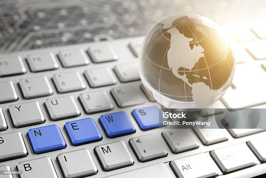 Global News Global News, glass Globe and Computer Keyboard with NEWS text The Media Stock Photo