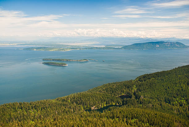 View of the San Juan Islands from Mount Constitution This view of the San Juan Islands was photographed from Mount Constitution in Moran State Park on Orcas Island, Washington State, USA. Twin Lakes is in the foreground. Barns, Clark and Lummi Islands are in the background. jeff goulden san juan islands stock pictures, royalty-free photos & images