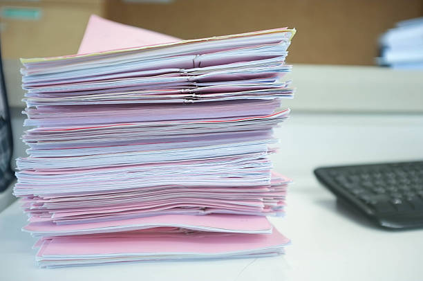 istock Many piles of papers on the desk 480951222