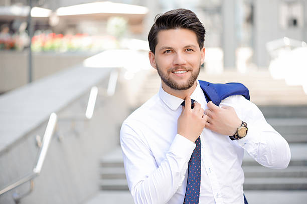 istock Young businessman holding jacket on shoulder 480951274